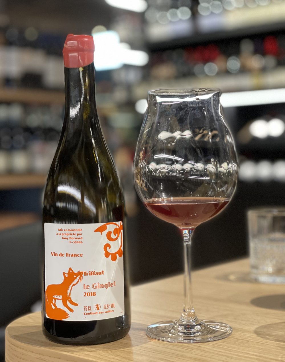 A bottle of Tony Bornard ‘Le Ginglet’ 2018 with a glass poured in the store